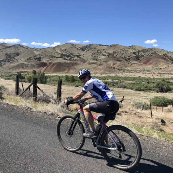 Gravel cyclist riding near the Painted Hills.