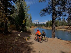 Riding bikes along the river.