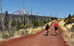 Mt Jefferson with gravel cyclists in foreground.