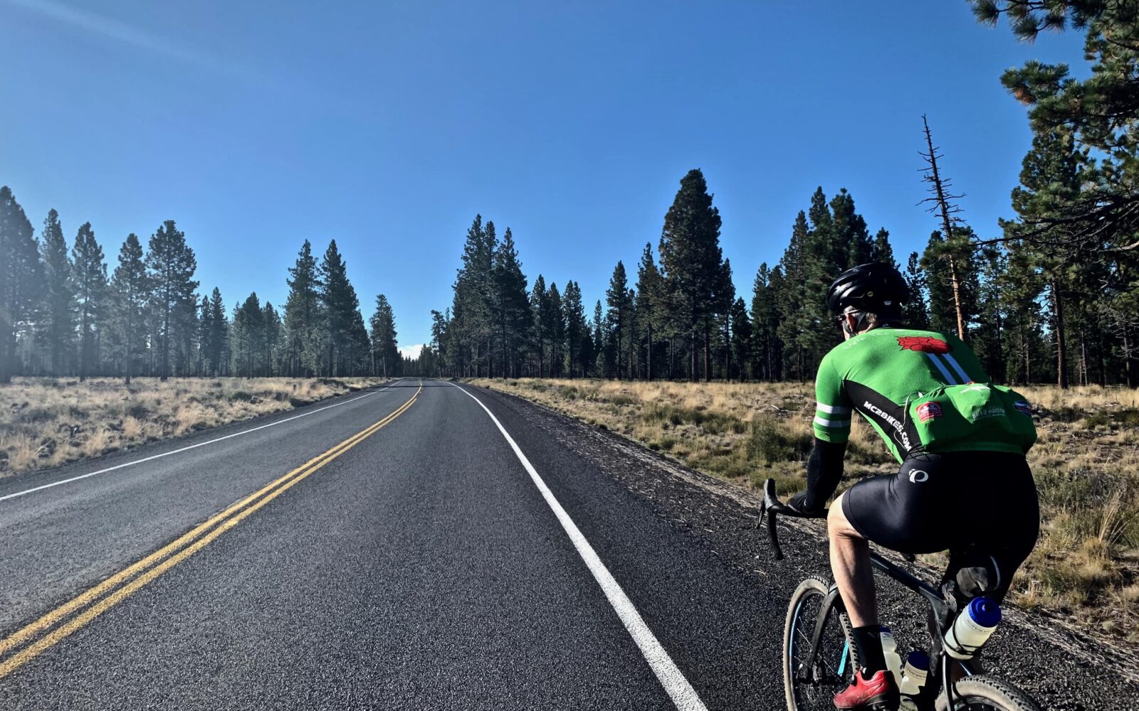 Riding on paved road to Paulina Peak.