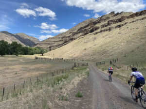 dry gravel road with cyclists in northeastern oregon