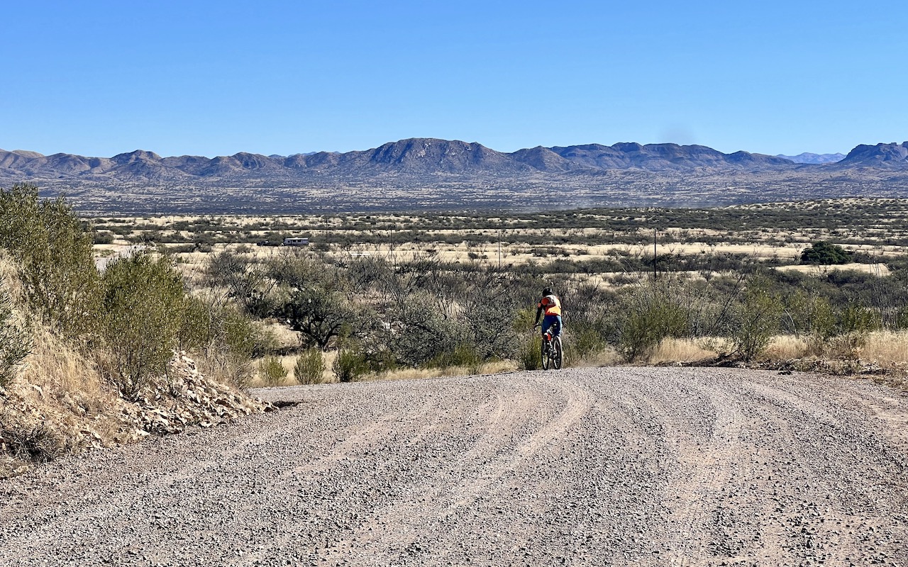 Riding gravel road leading away from Rancho de la Osa.