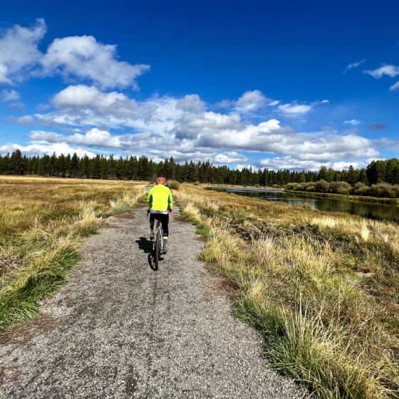 Riding gravel bike along Riley Meadow along Deschutes River.